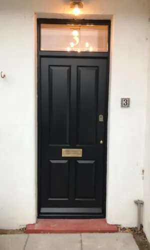 Solid raised and fielded panelled door - inkeeping with other doors at this coastal location