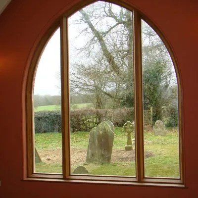 Bespoke wooden church window by Milland Joinery