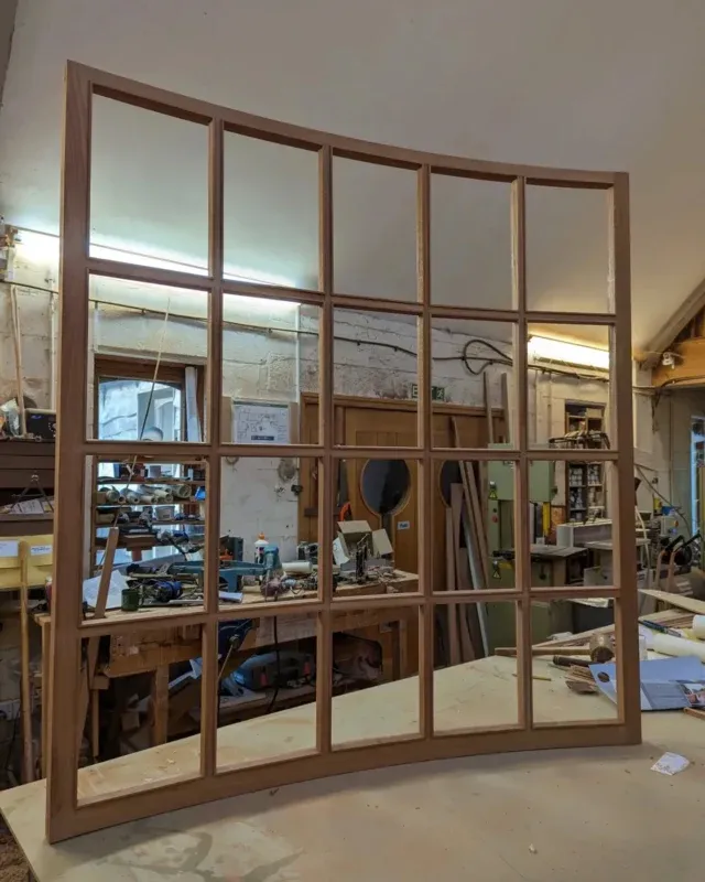 Beautiful curved window sash in the workshop ⚒️ Been great watching this come together, can't wait to see it place. 
.
.
.
#joineryworkshop #joinery #carpentry #carpentryskills #woodwork #craftmanship #skills #sapele #woodenwindows #curvedwindow