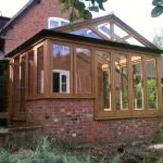 Bespoke wooden Conservatory by Milland Joinery