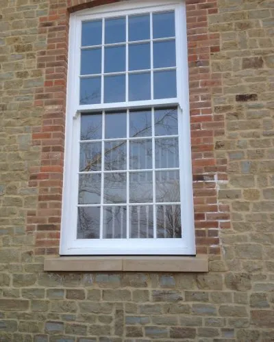 Bespoke wooden window by Milland Joinery