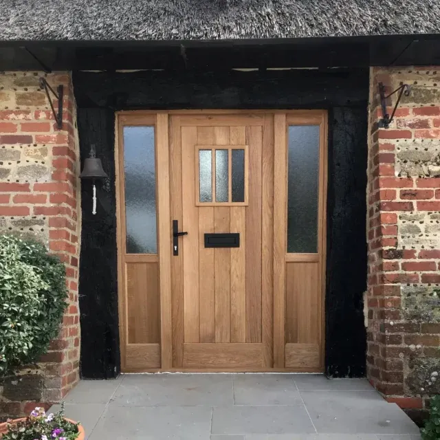 Another beautiful Oak door in place in this lovely country house. The use of half glazed, obscure sidelights lets some more natural light into the entrance way. We especially like the door window with the delicate bars. 
.
.
.
#joineryworkshop #joinery #carpentry #woodwork #wooddesign #timber #wood #countryhome #homeimprovements #oak #pilkington #osmooil #craftmanship #woodskills